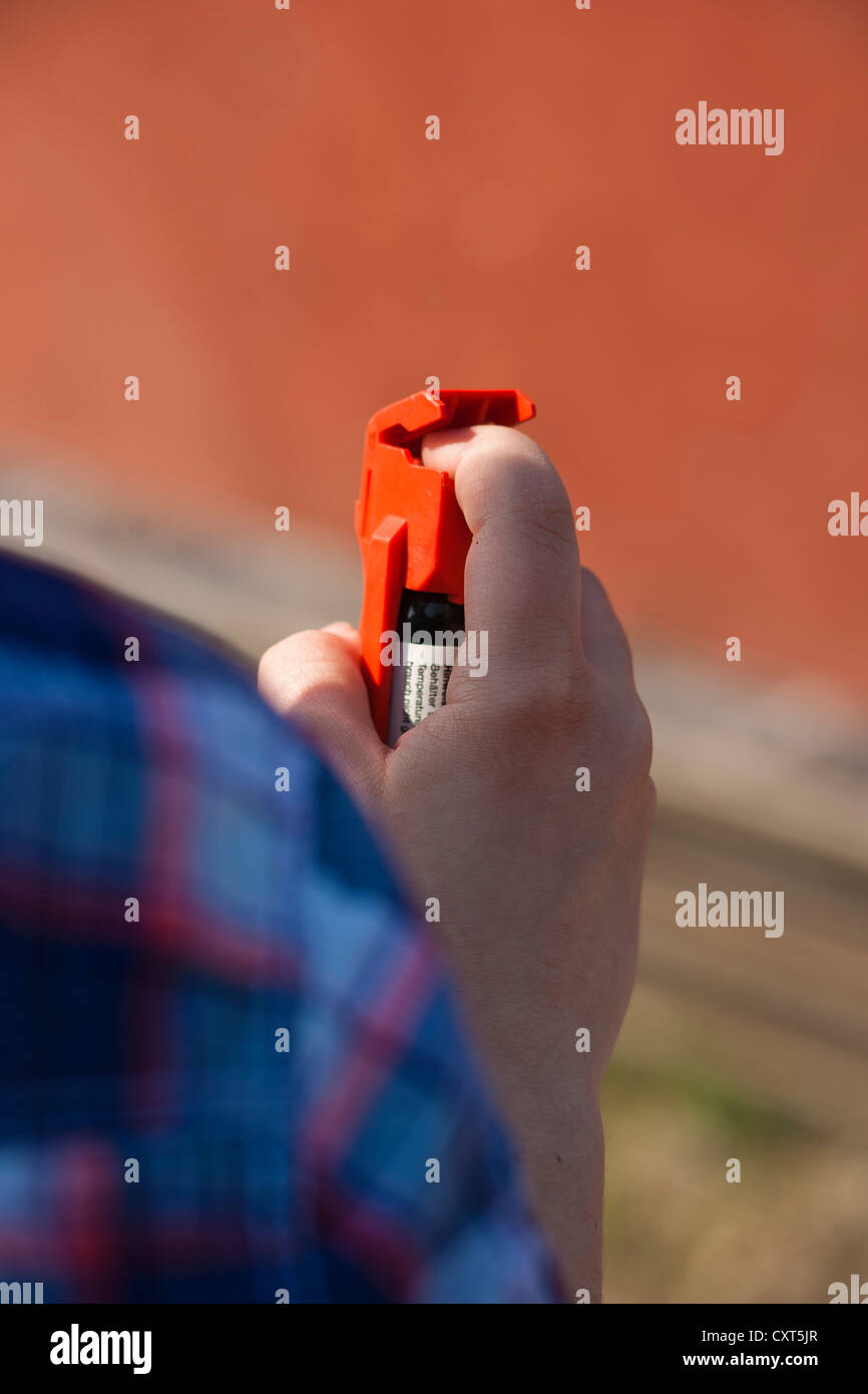 Girl holding a tear gas spray in her hand Stock Photo Alamy