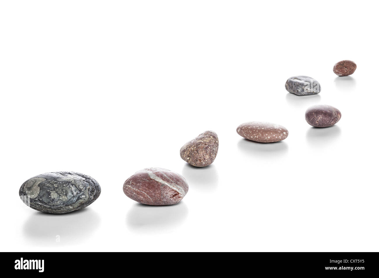 Stepping Stones or pebbles on a white background with soft natural shadow. Focus stack, in focus front to back. Stock Photo