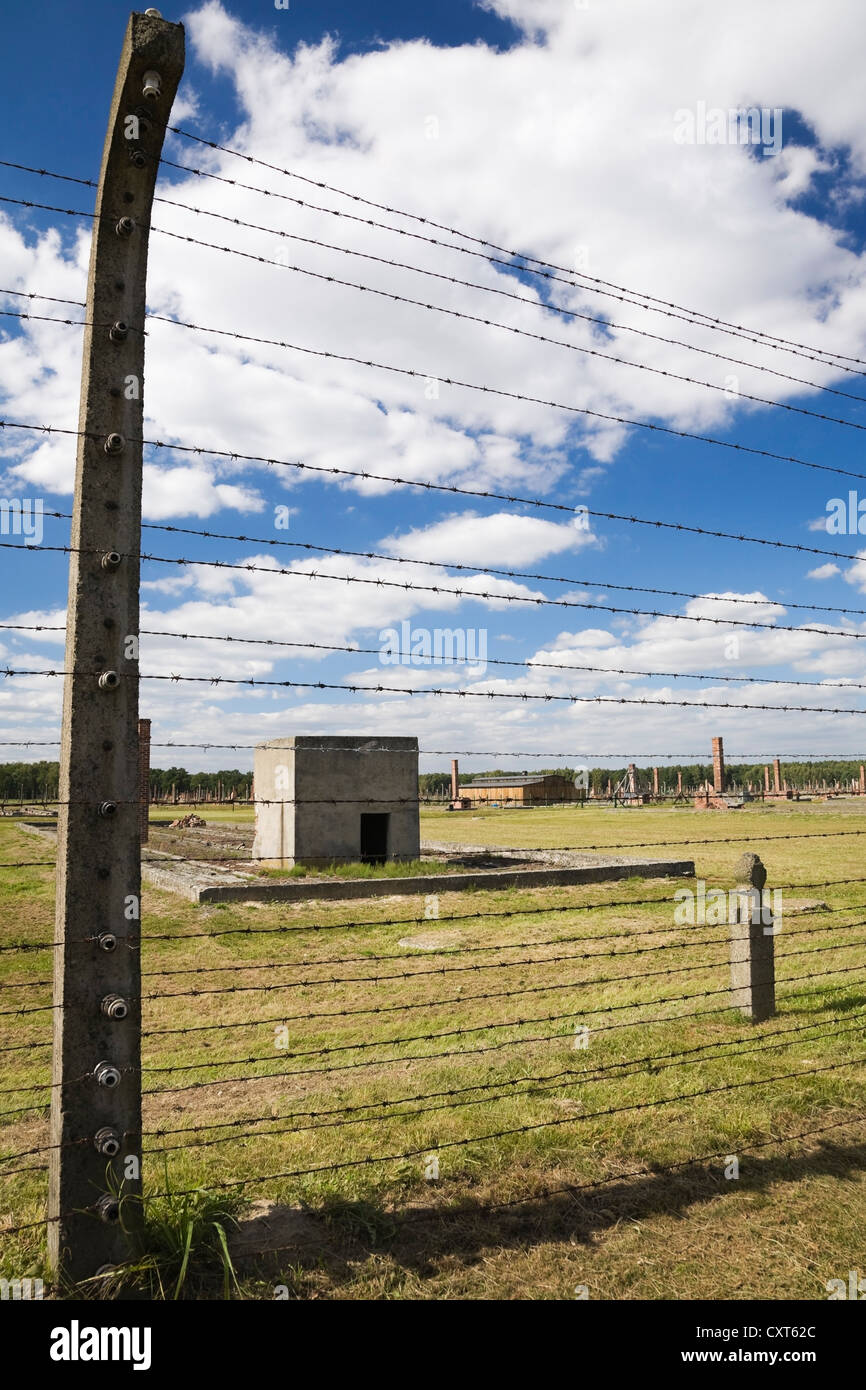 Barb wire electric fence inside the Auschwitz II-Birkenau former Nazi Concentration Camp, Auschwitz-Birkenau, Poland, Europe Stock Photo