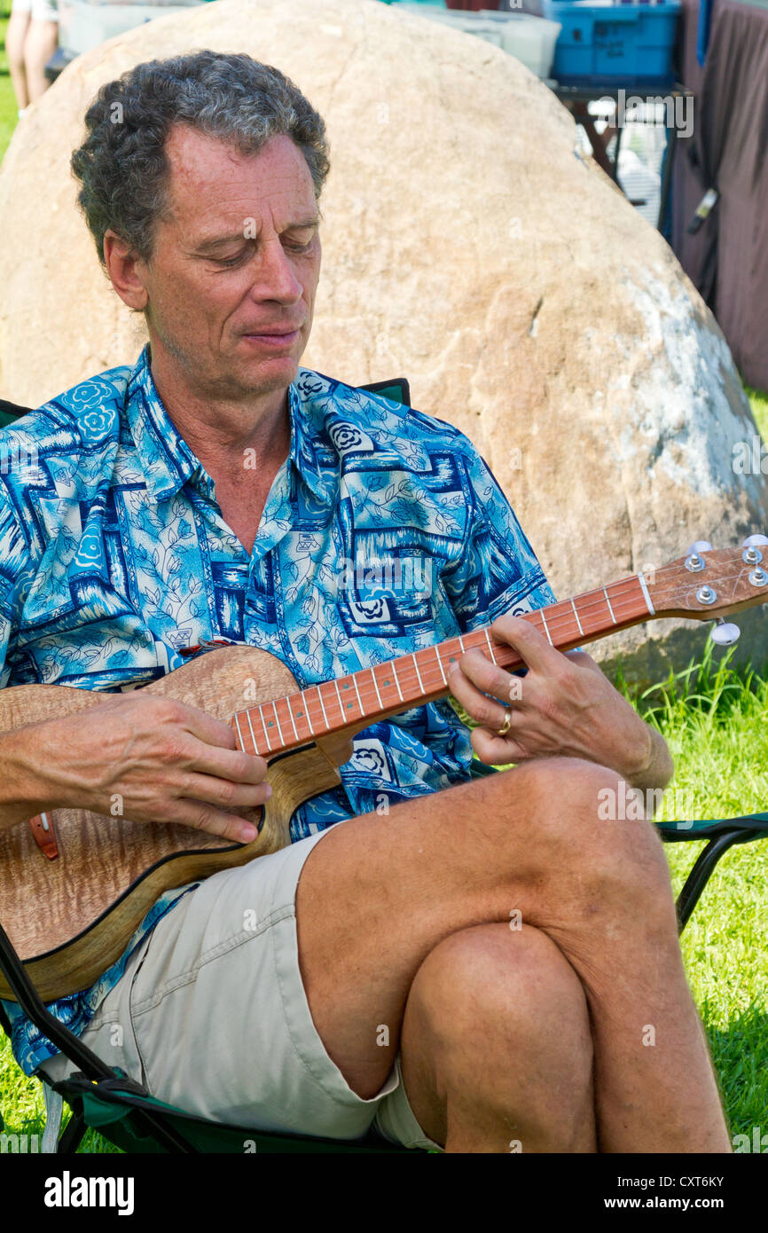 Man playing ukulele Stock Photo Alamy