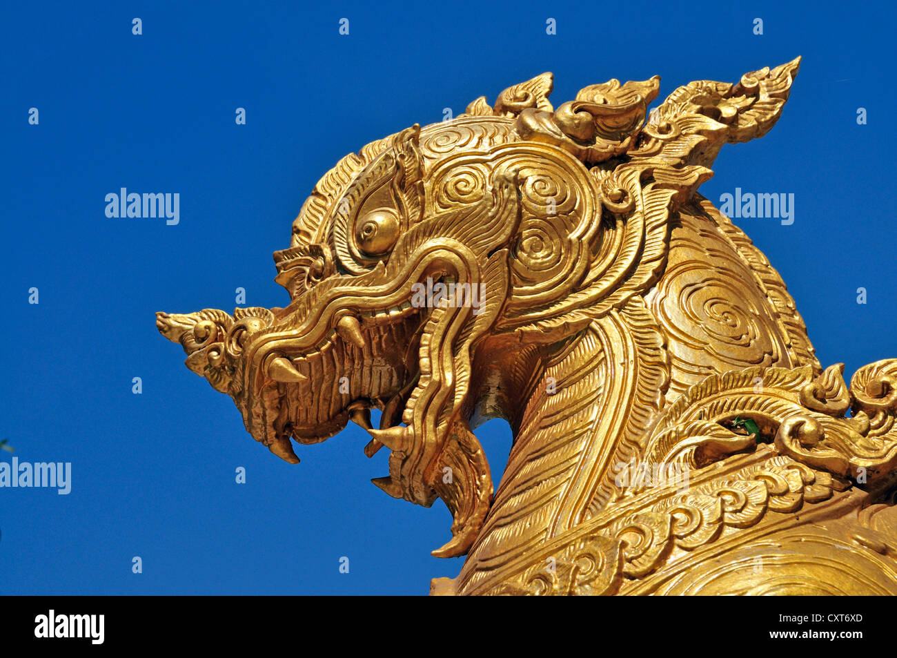 Entrance with golden guardian figures hi-res stock photography and ...