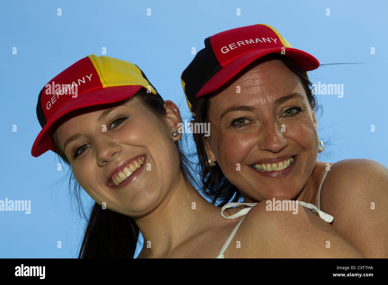 Two women wearing 'Germany' caps, portrait Stock Photo