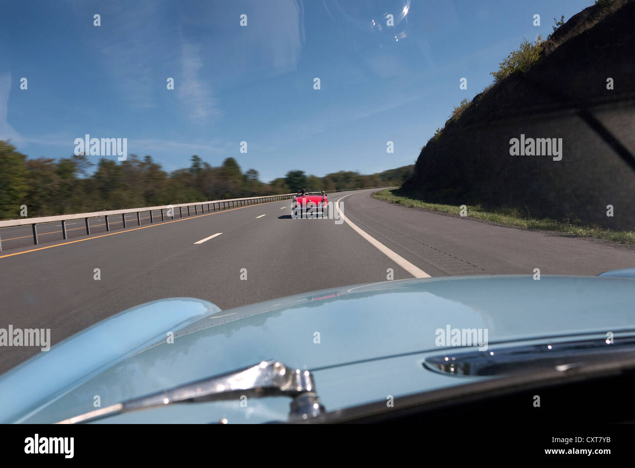 Alfa Spider viewed on the highway in New York state USA from by driver of MGB Stock Photo