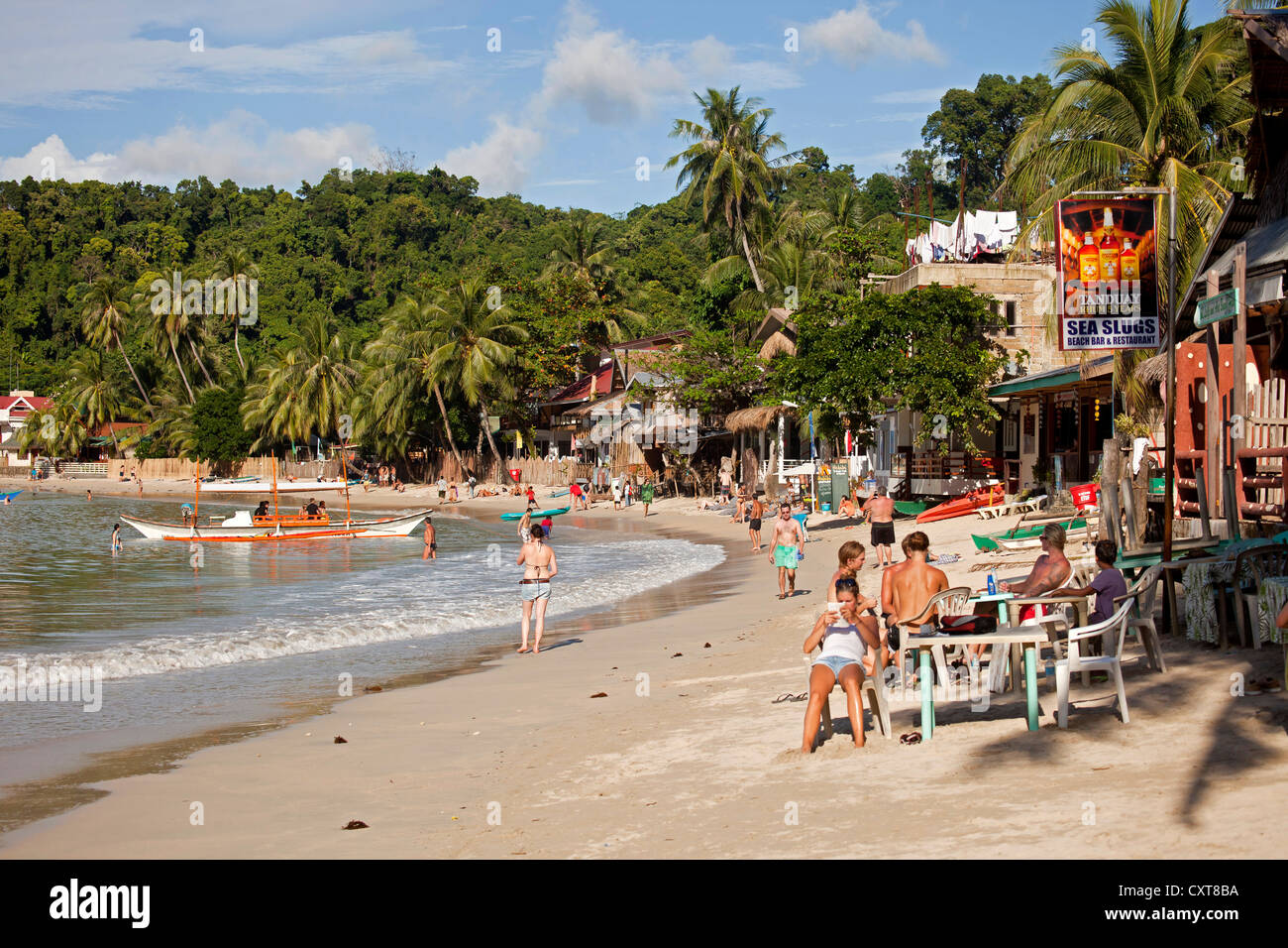 Beach bar and tourists on the beach, El Nido, Palawan, Philippines, Asia Stock Photo