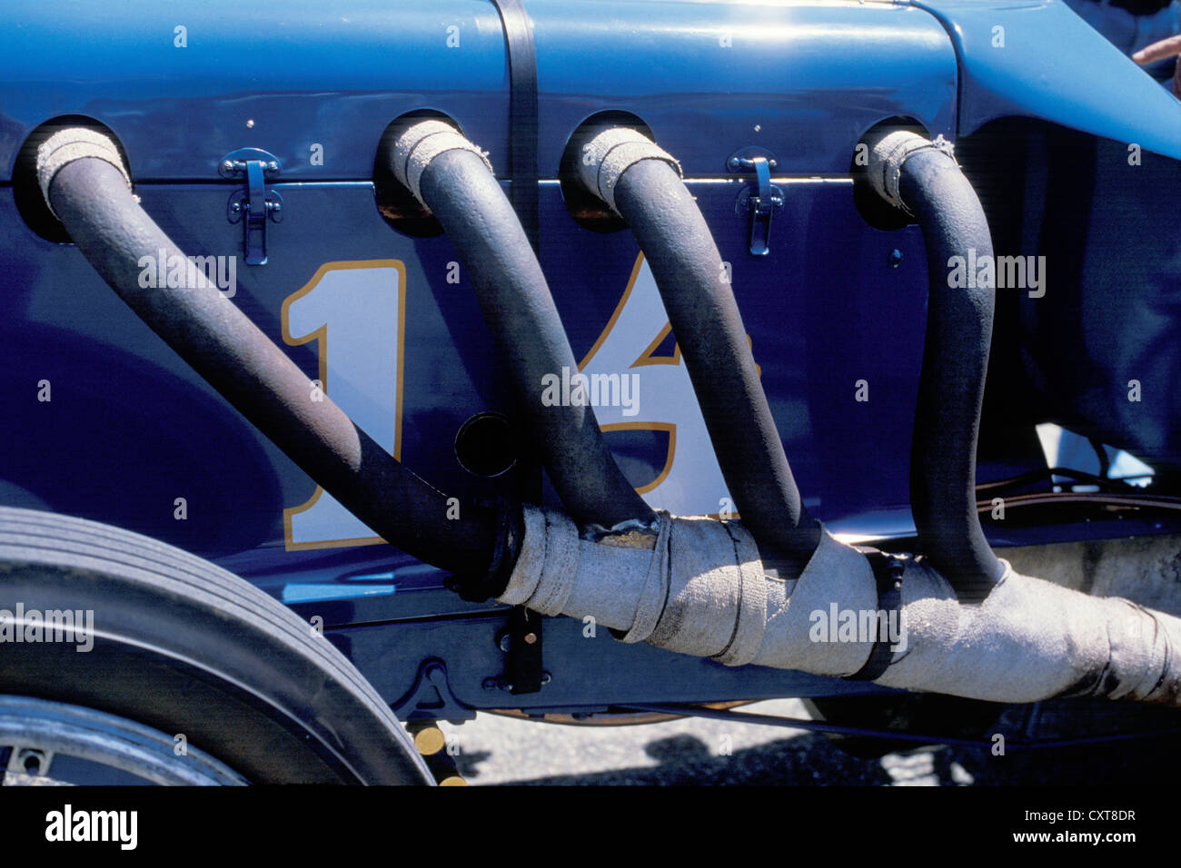 Detail of exhaust headers on a vintage race car at the Monterey Historic Car Races Stock Photo