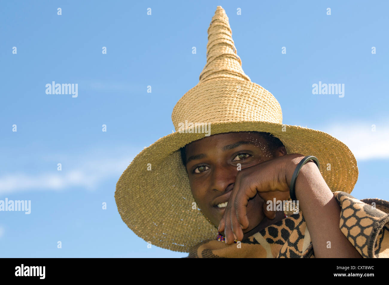 young-basotho-man-wearing-a-traditional-hat-portrait-drakensberg-kingdom-CXT8WC.jpg