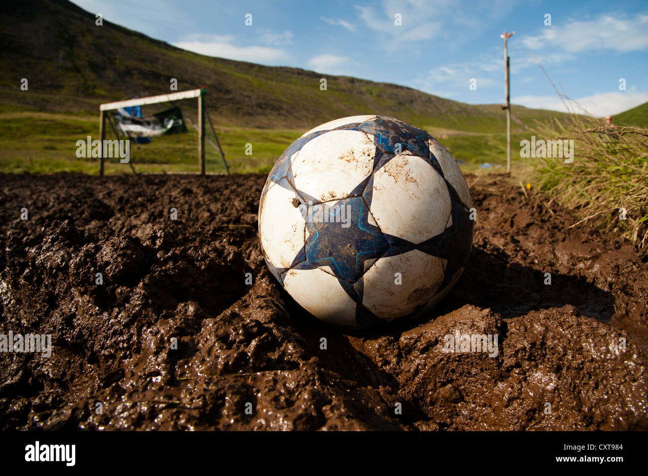 A soccer ball and a goal, European championships of mud-soccer, town of Isafjordur, West Fjords, Iceland, Europe Stock Photo