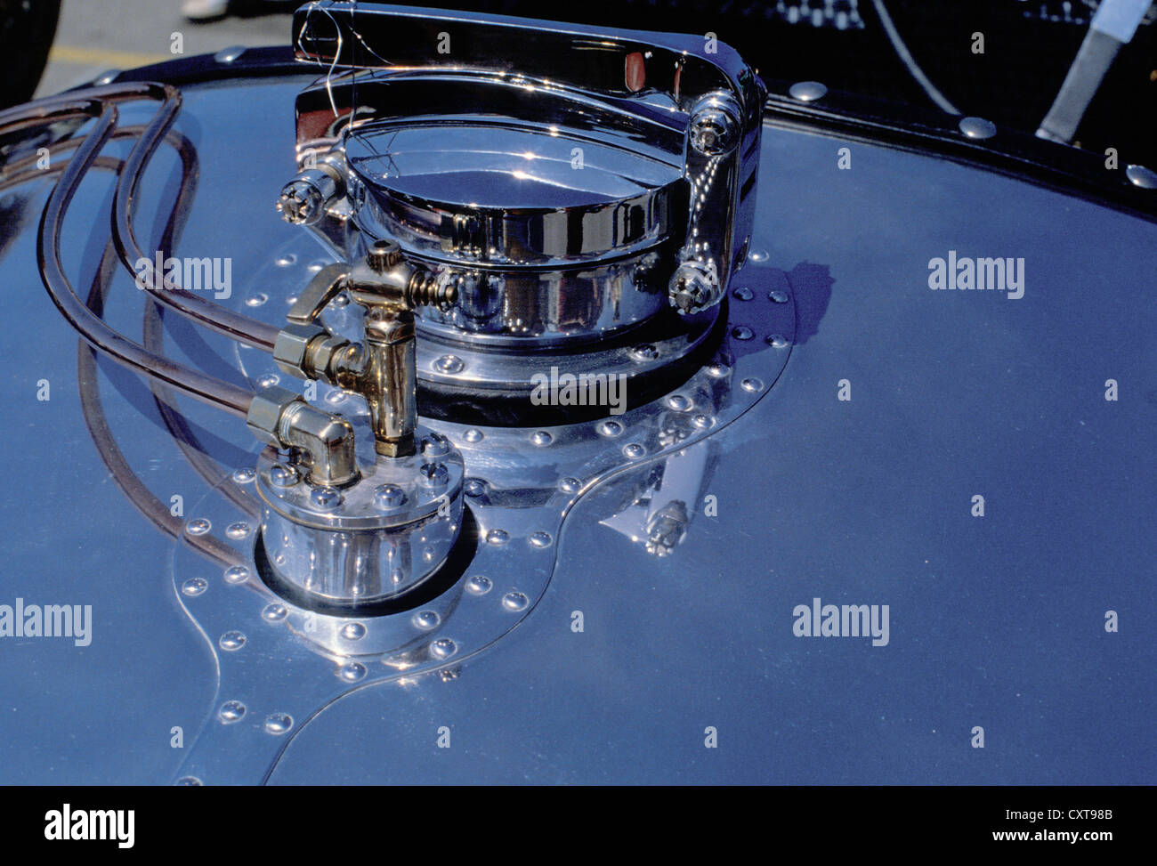 Fuel cap and valve closeup detail on a vintage race car in the Monterey