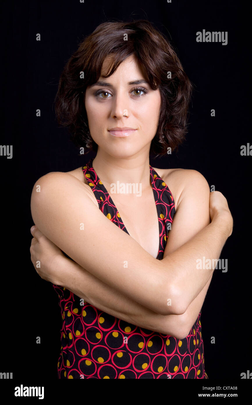 young beautiful brunette portrait against black background Stock Photo ...