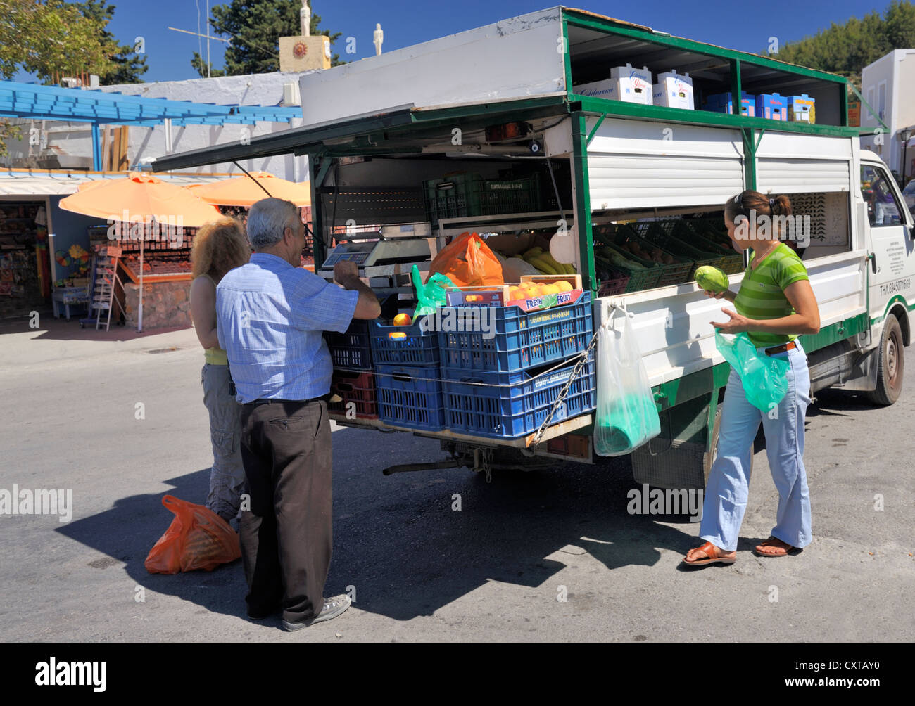 Fruit and vegetable delivery and sale by van in small village, Greece Stock  Photo - Alamy