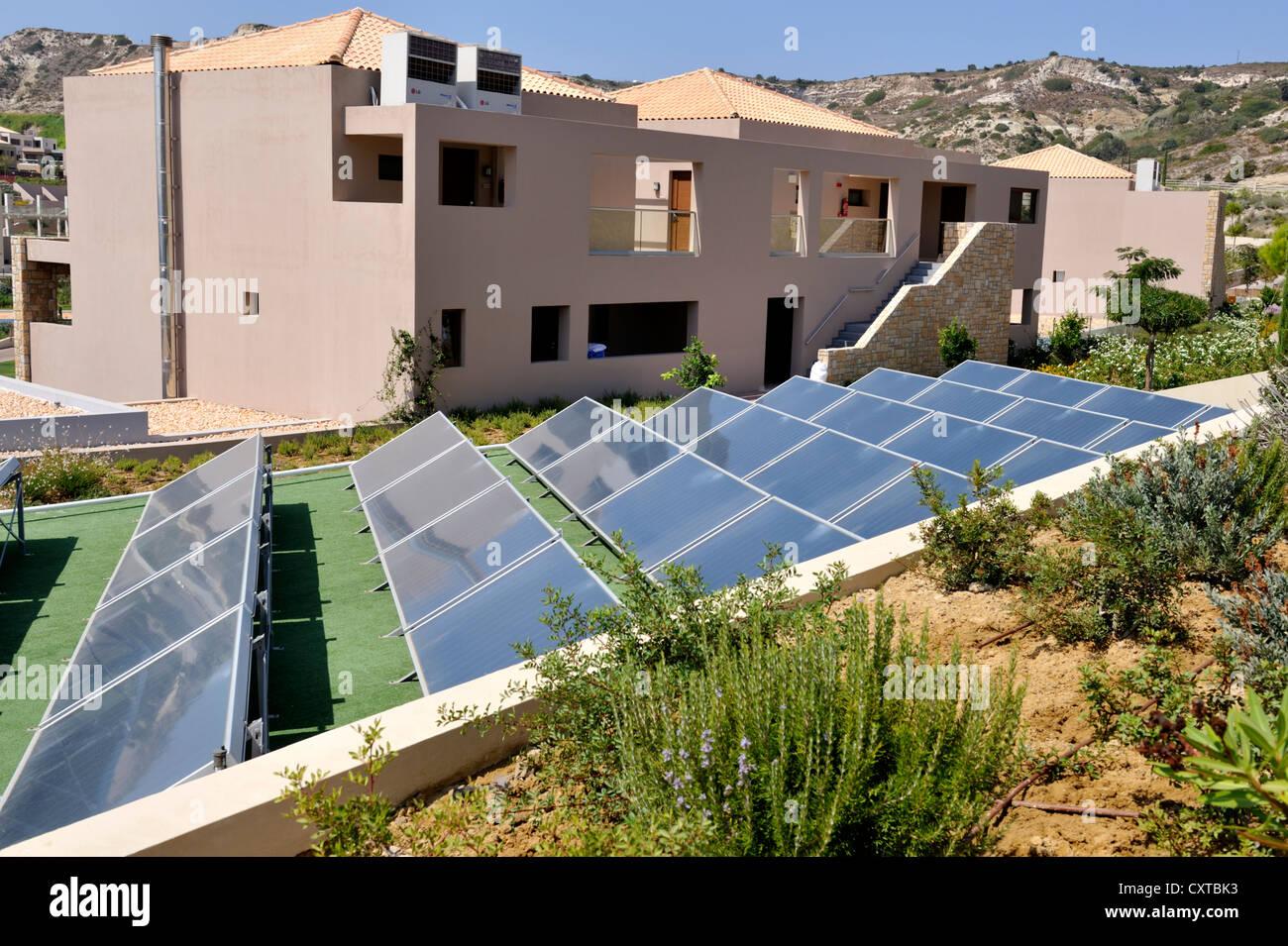 Solar thermal collectors. Roof top array on resort building, Greece ...