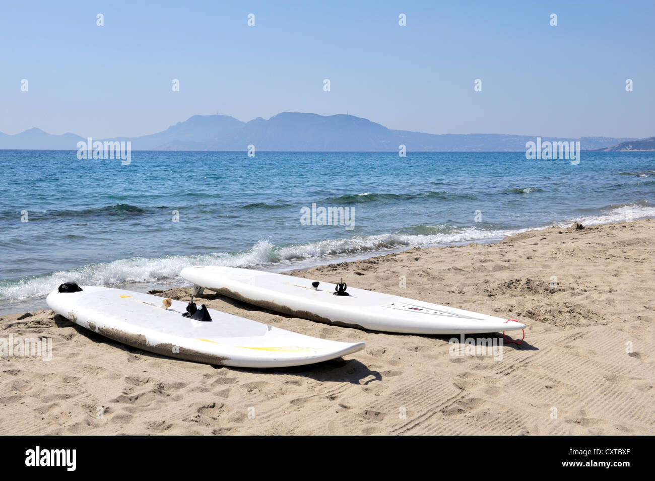 Surfboards on sandy beach, island of Kos, Greece Stock Photo Alamy