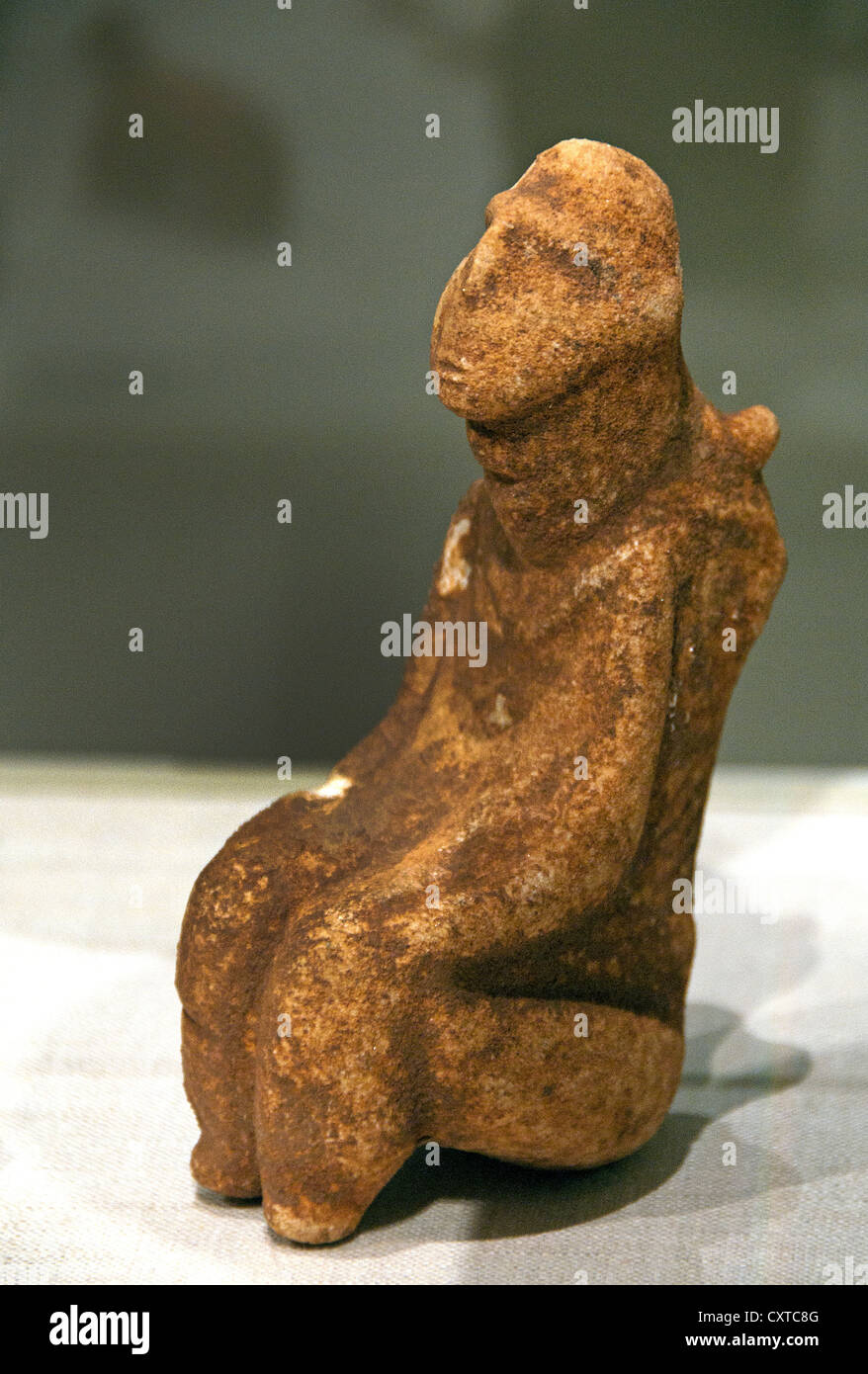 Marble Woman figure Aegean  final neolithic 5000-3500 B.C. grotesque Female figure Child cling to her Back Greek Greece Stock Photo