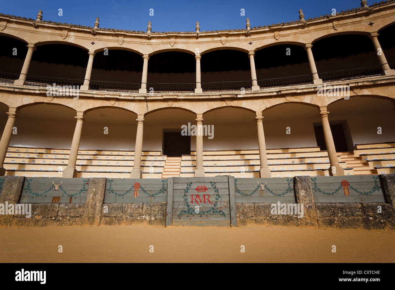Decorative boards placed around security ring in Ronda bullfight arena in front of seating areas. Stock Photo