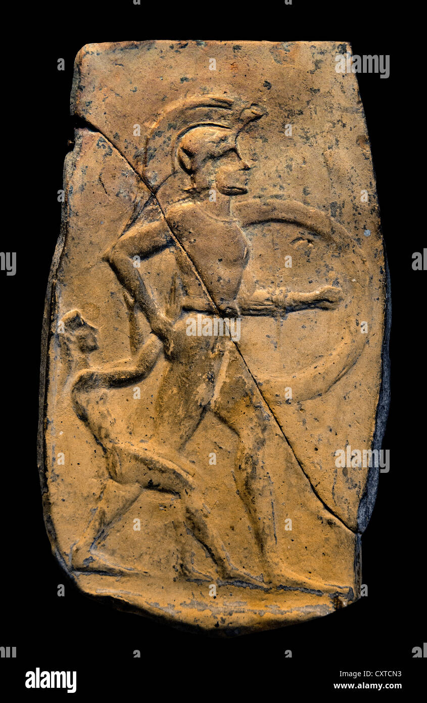Terracotta relief of a warrior dragging a captive Archaic ca. 540–520 B.C. Greek Cretan 20cm Greece Stock Photo