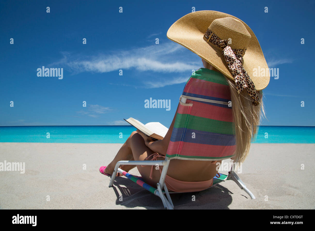 Woman Sitting In Beach Chair High Resolution Stock Photography and
