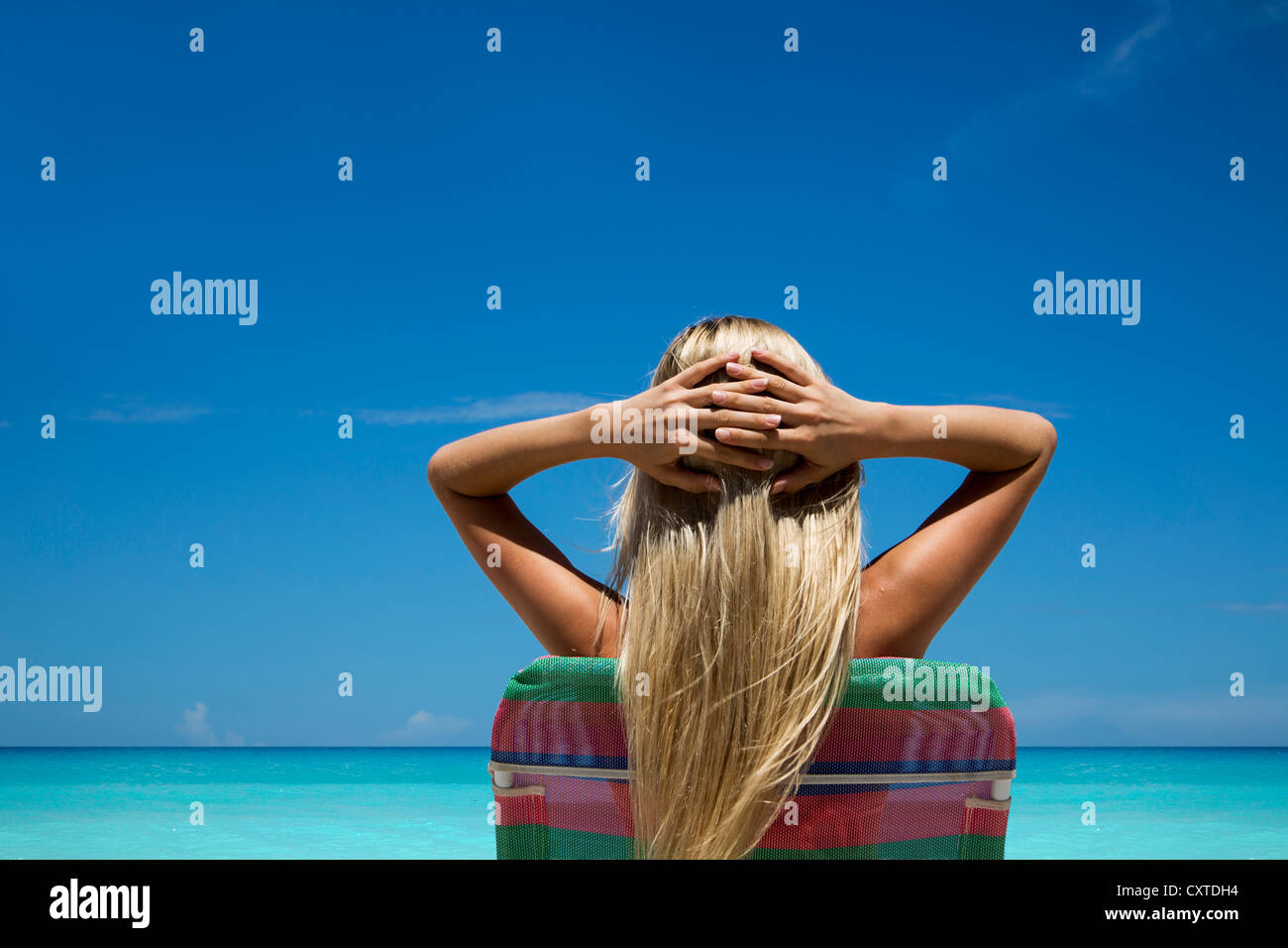 Woman relaxing in lawn chair hi-res stock photography and images - Alamy