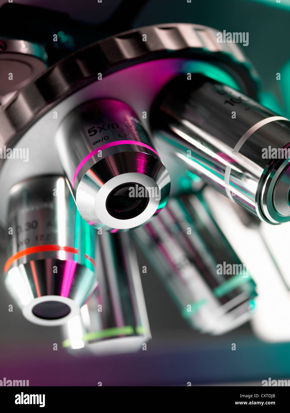 Close up of microscope lenses in lab Stock Photo