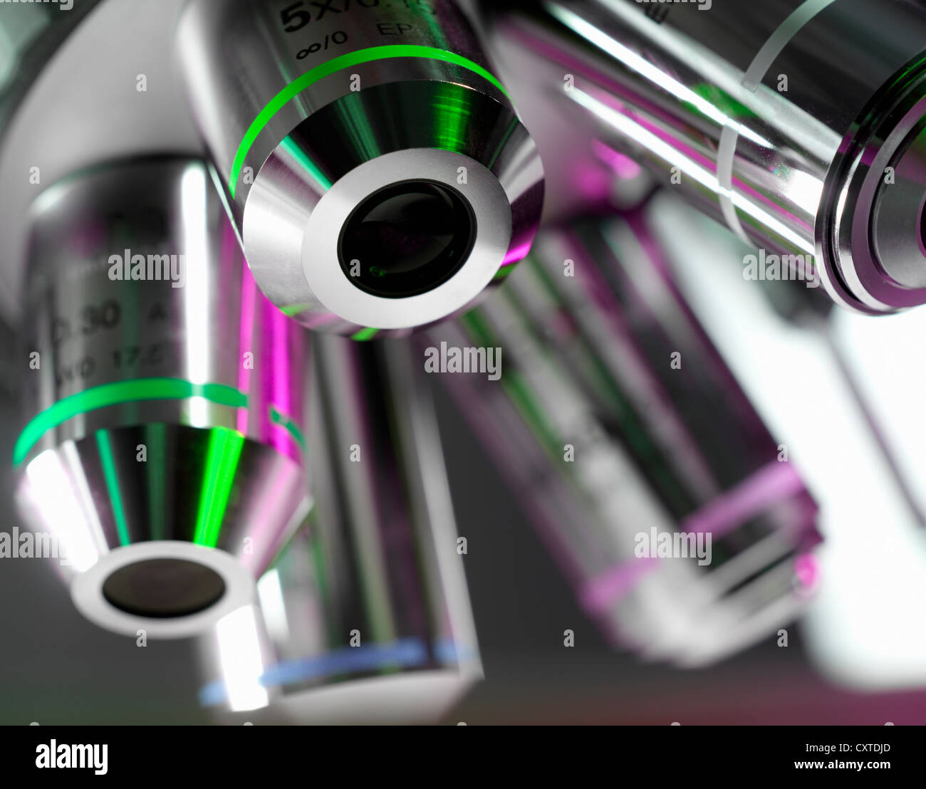 Close up of microscope lenses in lab Stock Photo