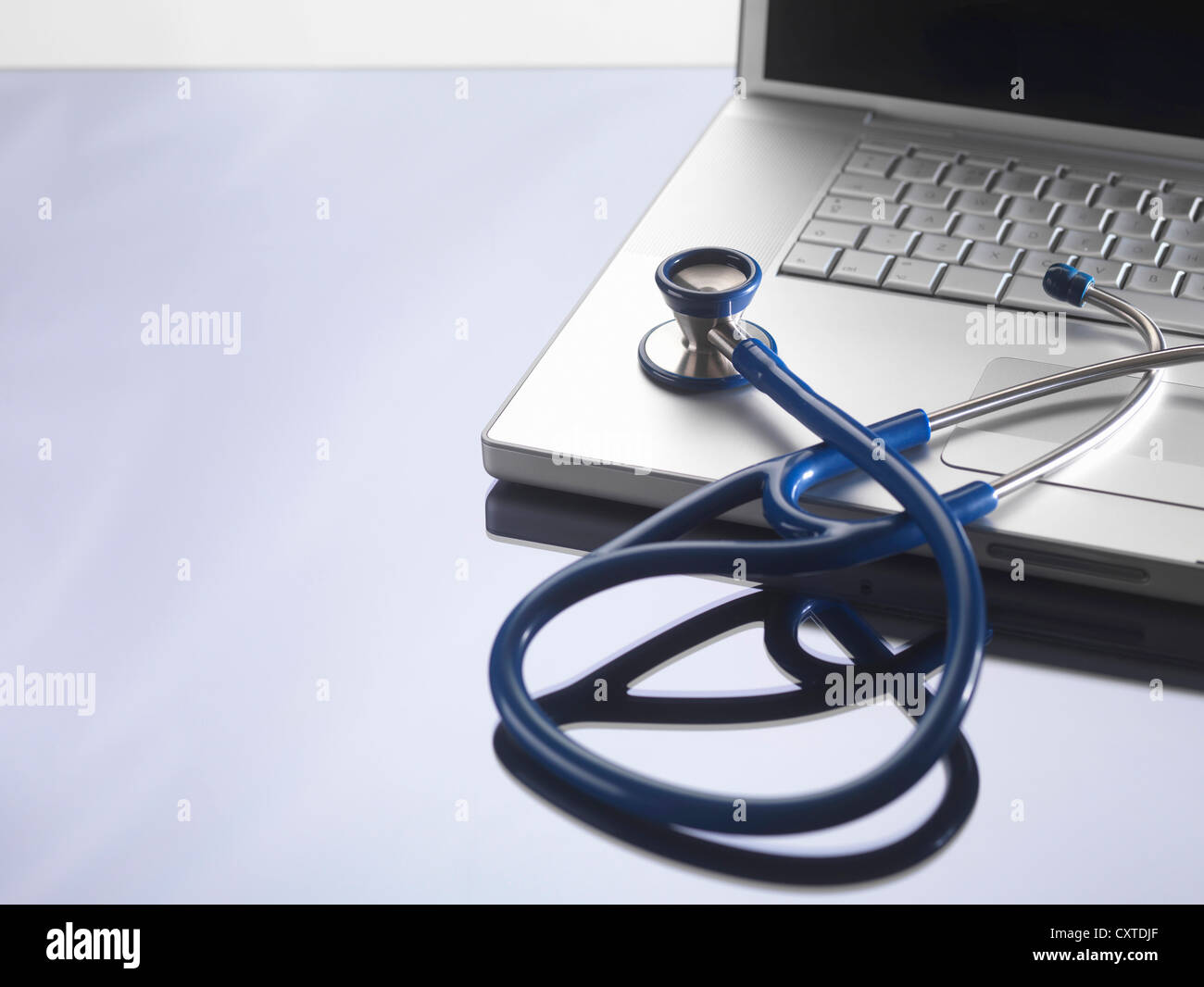 Close up of stethoscope on laptop Stock Photo