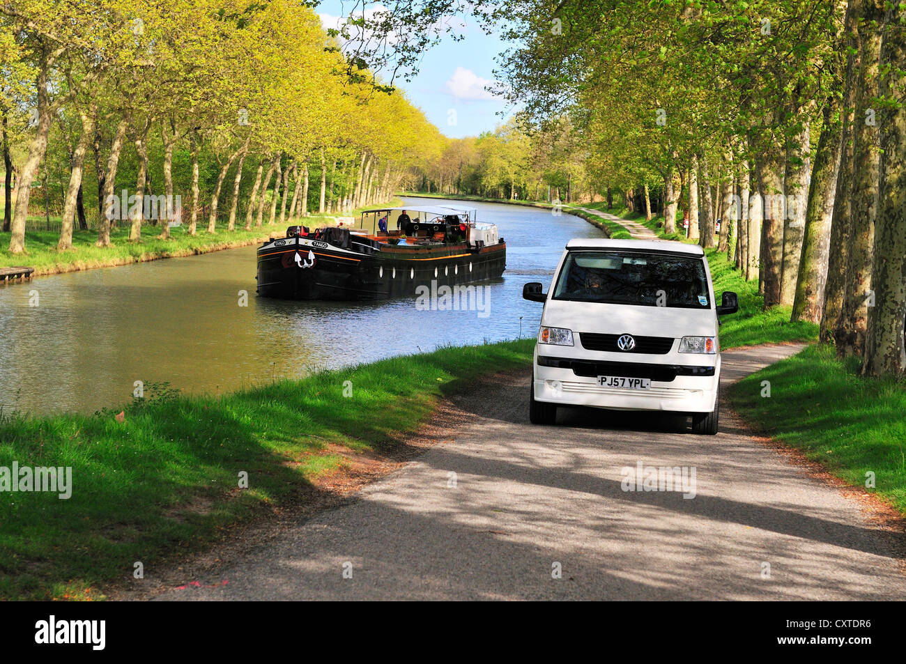 Scene of canal barge going towards the summit of the Canal du Midi with