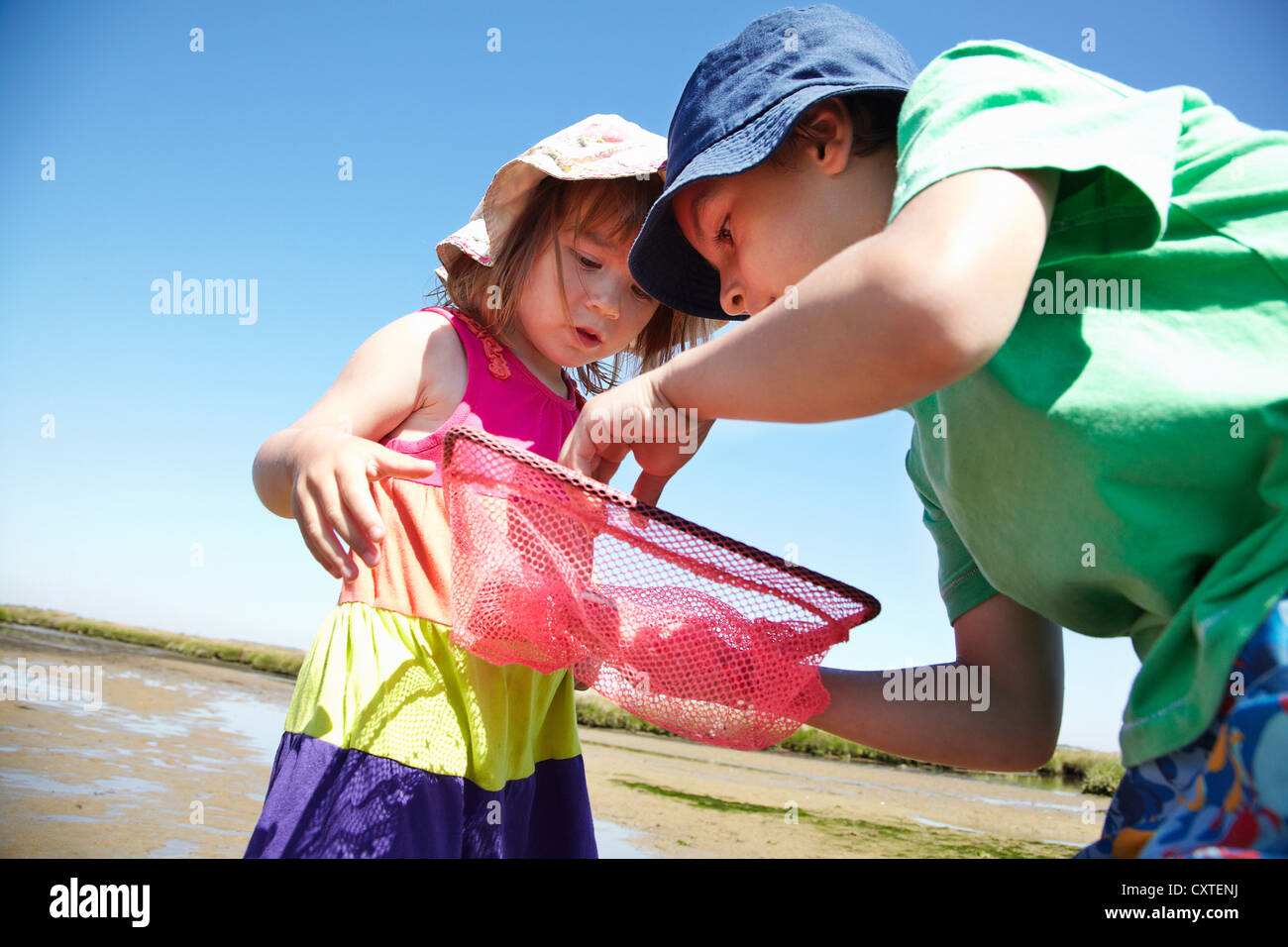 Children examining fishing nets Stock Photo Alamy