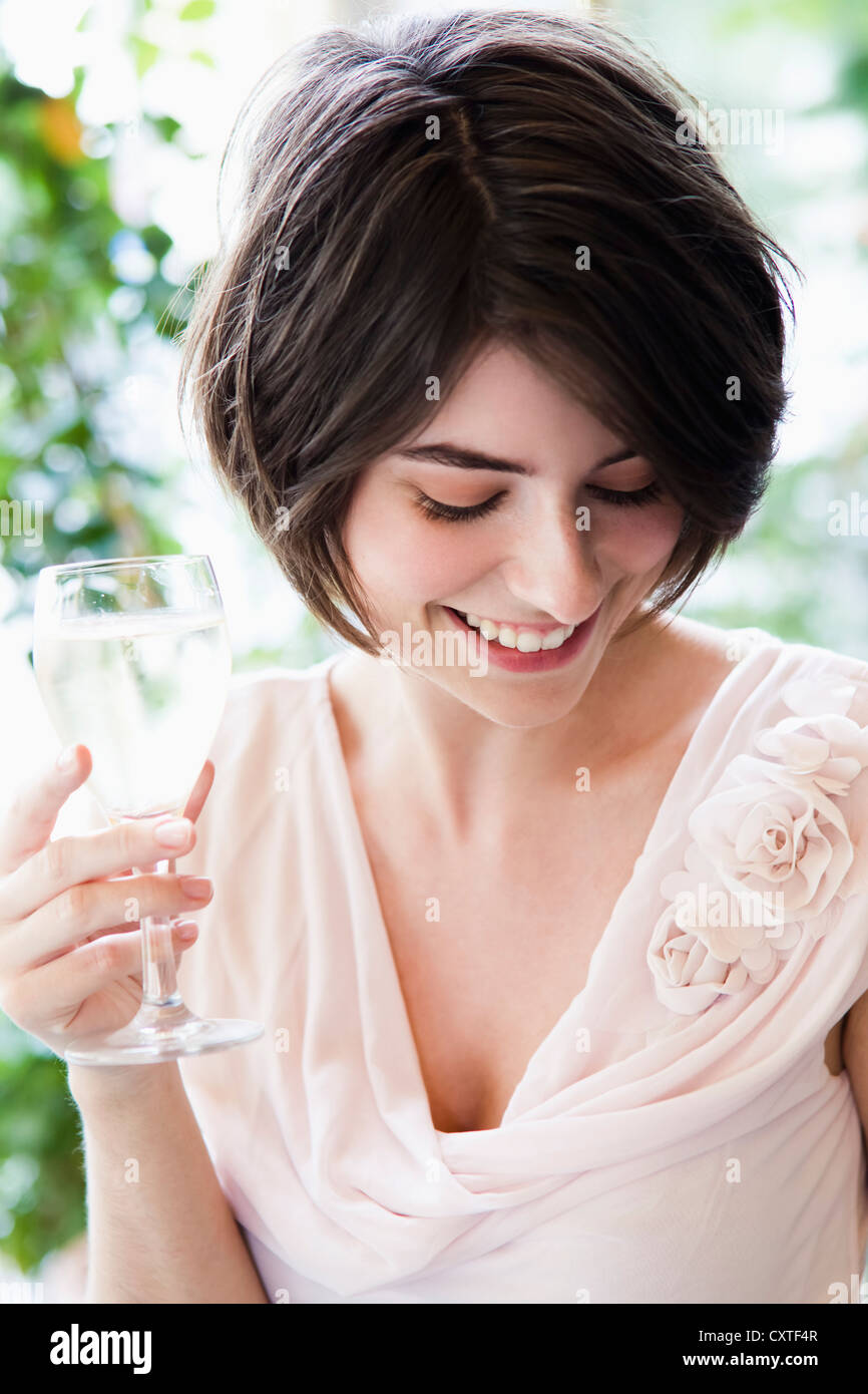 Woman having glass of wine outdoors Stock Photo