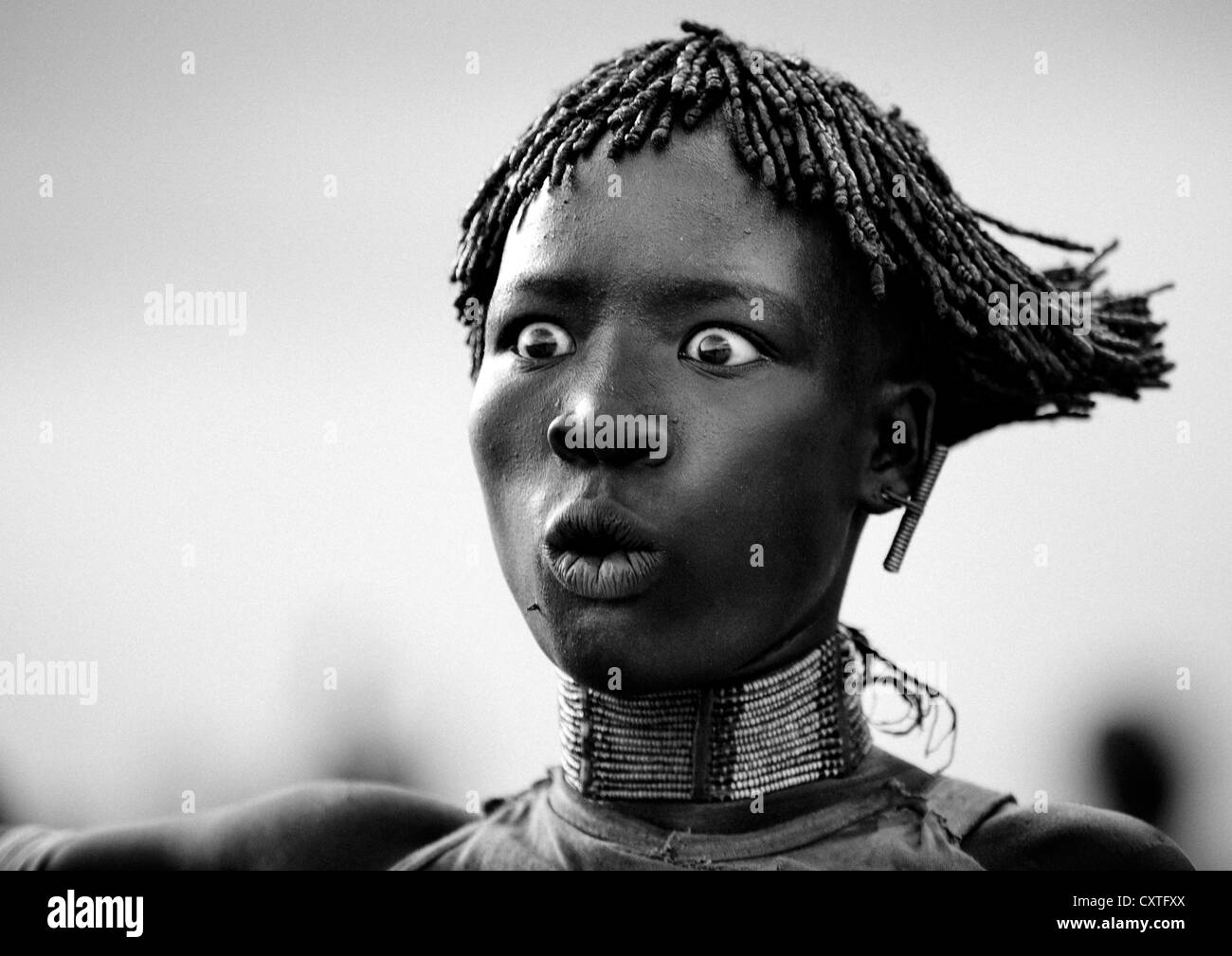 Expressive Portrait Of A Hamar Tribe Woman During Bull Jumping Ceremony, Turmi, Omo Valley, Ethiopia Stock Photo