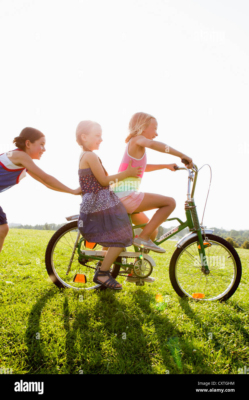 girls push along bike