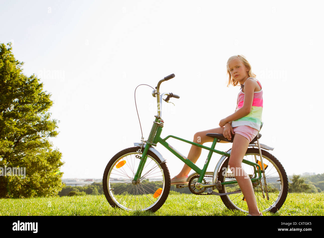 girl sitting on bike