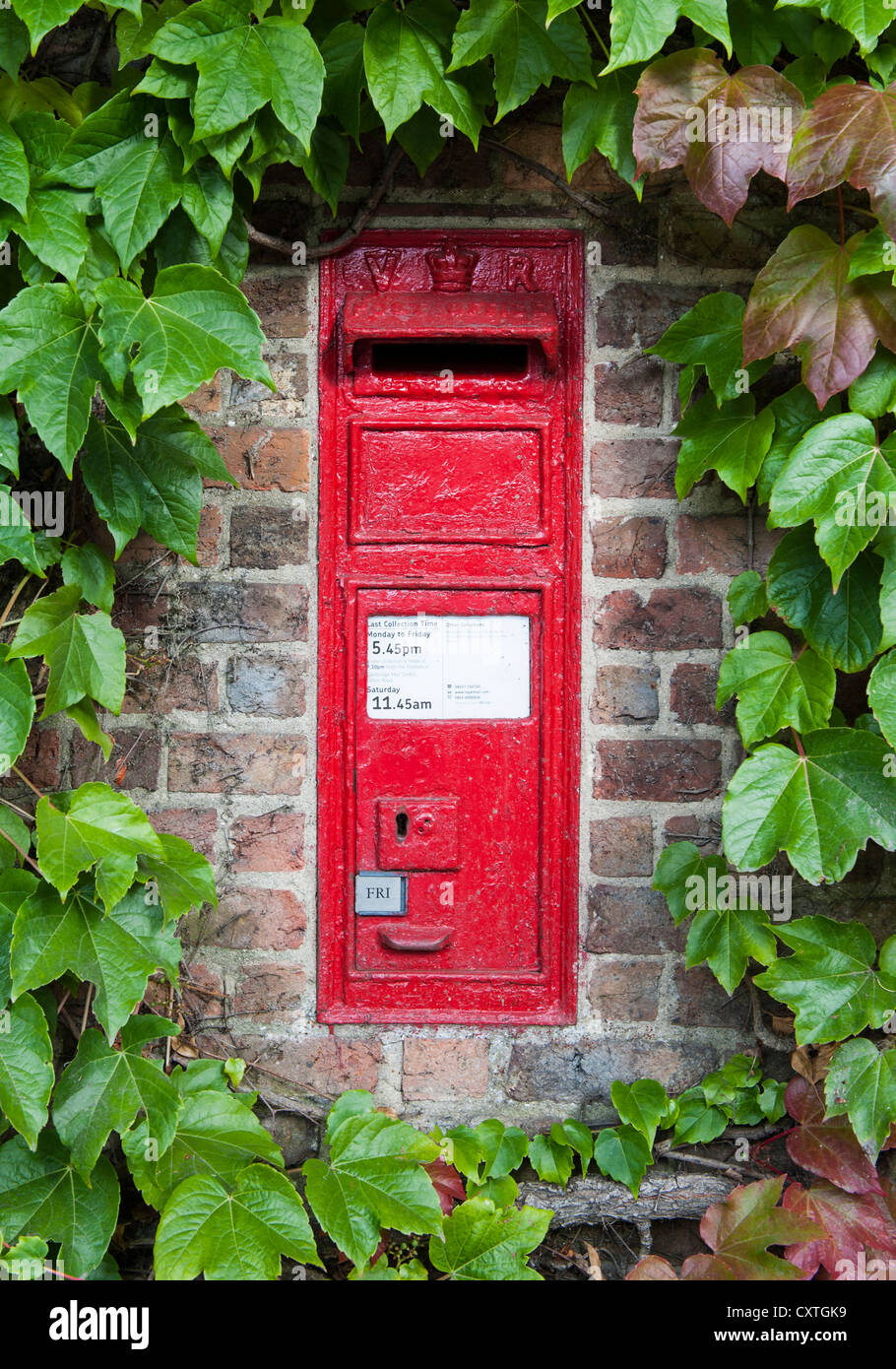 An original Victorian post box, still in use, in Grantchester, Cambridgeshire, England Stock Photo