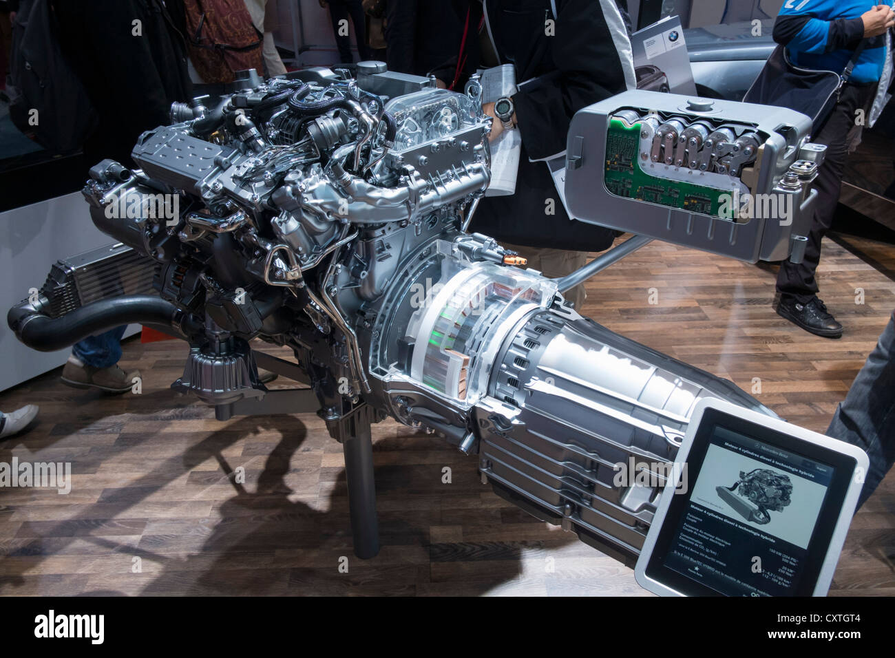 New Mercedes Benz hybrid diesel - electric engine and motor on display at Paris Motor Show 2012 Stock Photo