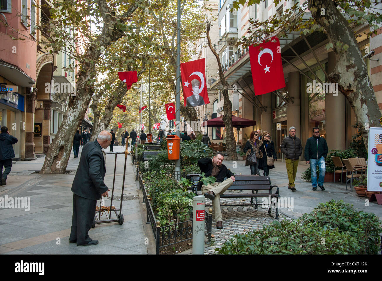 Pedestrian street with large Turkish flags near the Grand Bazaar in Istanbul Turkey Stock Photo