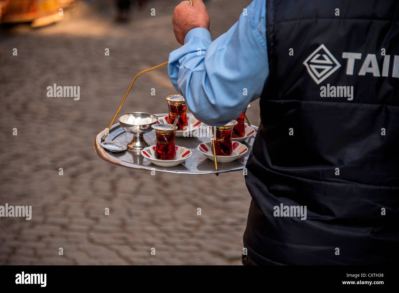 Tea-seller carrying  a tray with glasses of tea in Istanbul Turkey Stock Photo