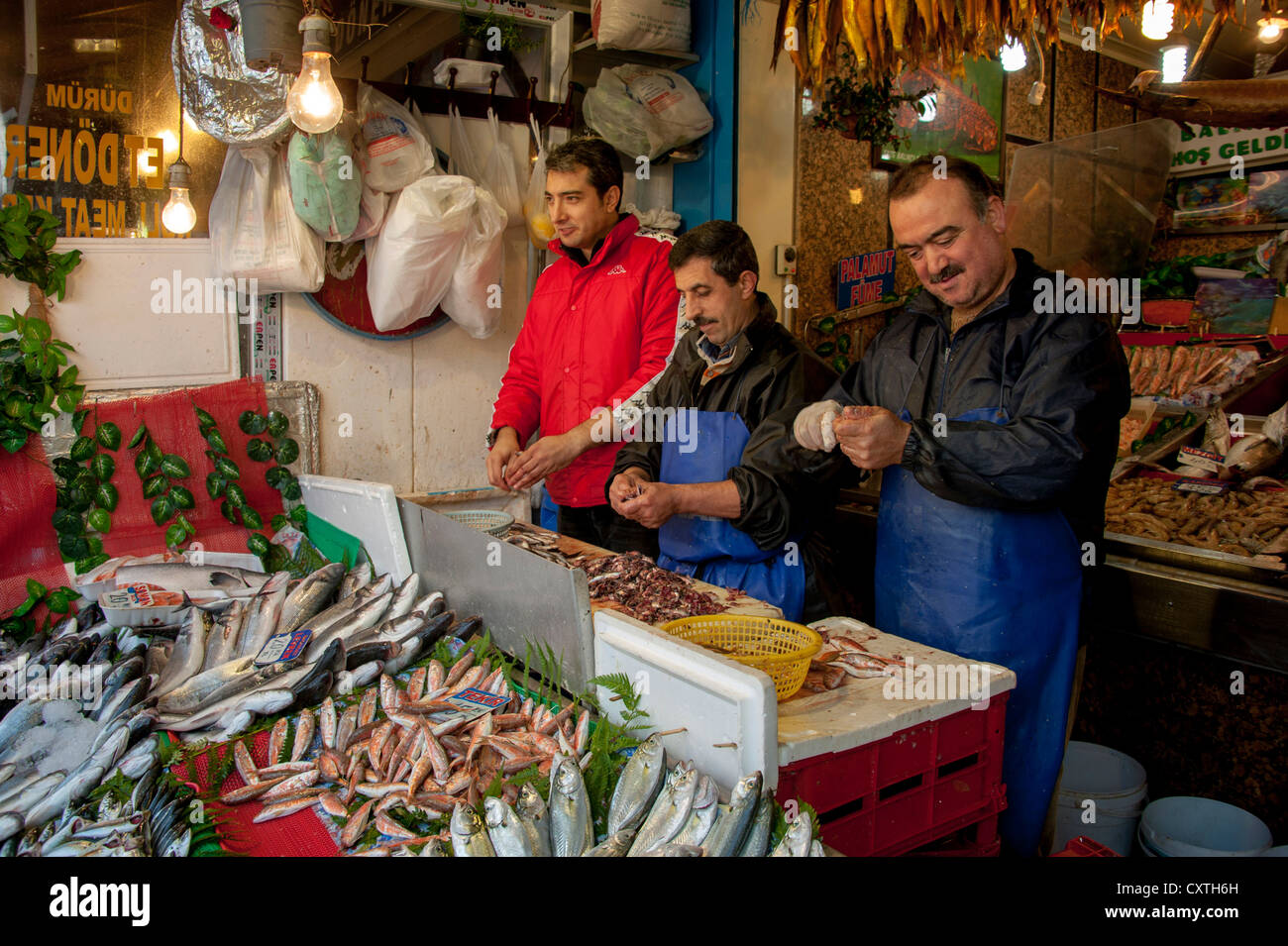 cleaning fish in the market near the Spice Bazaar in Istanbul Turkey Stock Photo