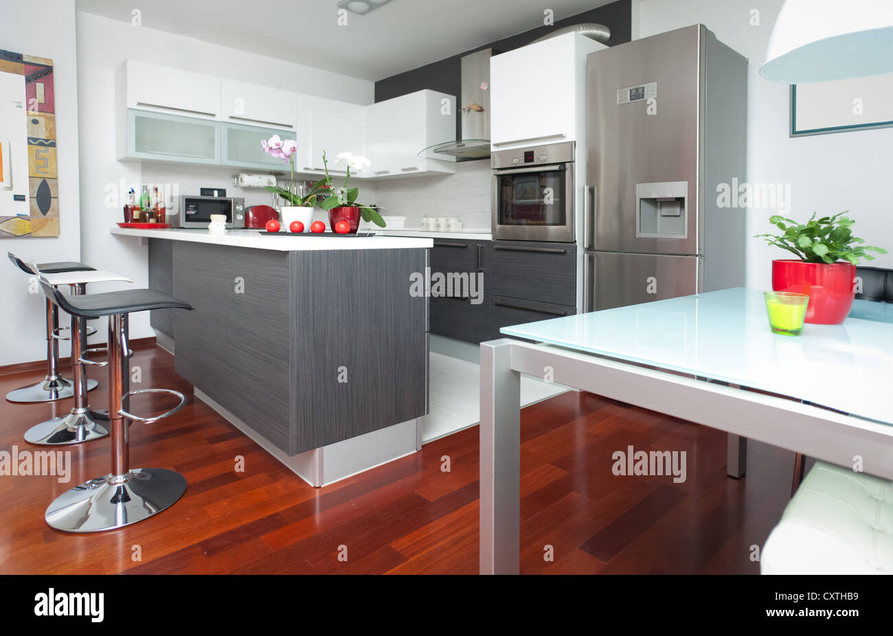 Modern interior of open-plan kitchen and living room Stock Photo - Alamy
