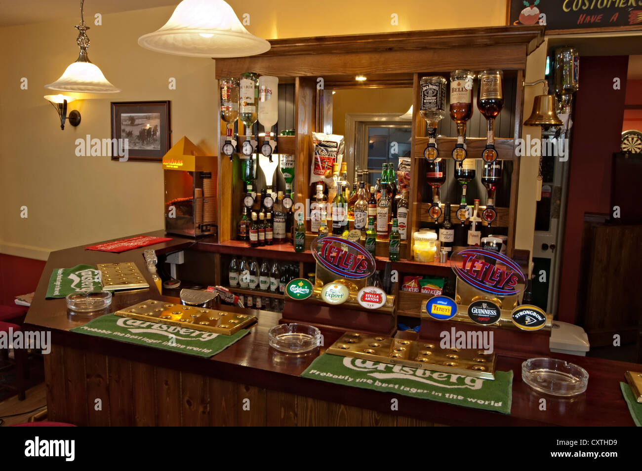 kings arms pub bar with beer pumps and spirits Stock Photo