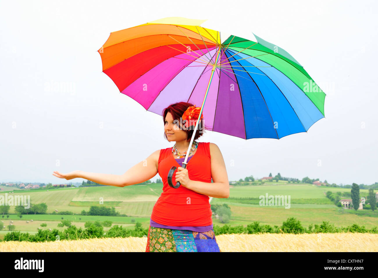 Woman holding colorful umbrella Stock Photo