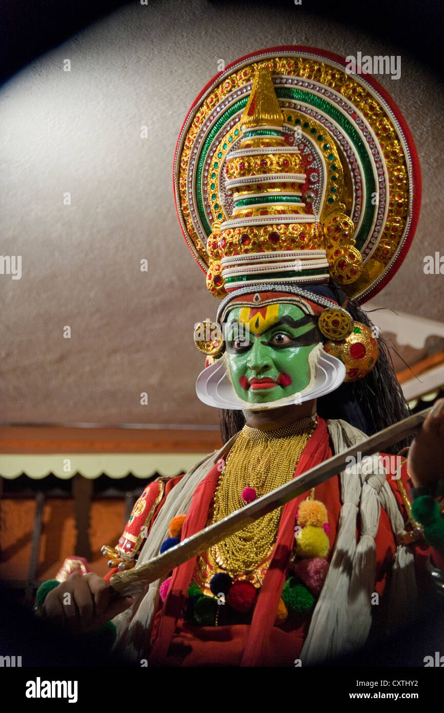 Vertical close up portrait of a Kathakali artist in full costume during a performance. Stock Photo