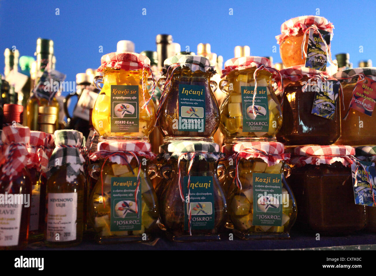 Jars of cheese in olive oil on display at the market stall in Sveti ...