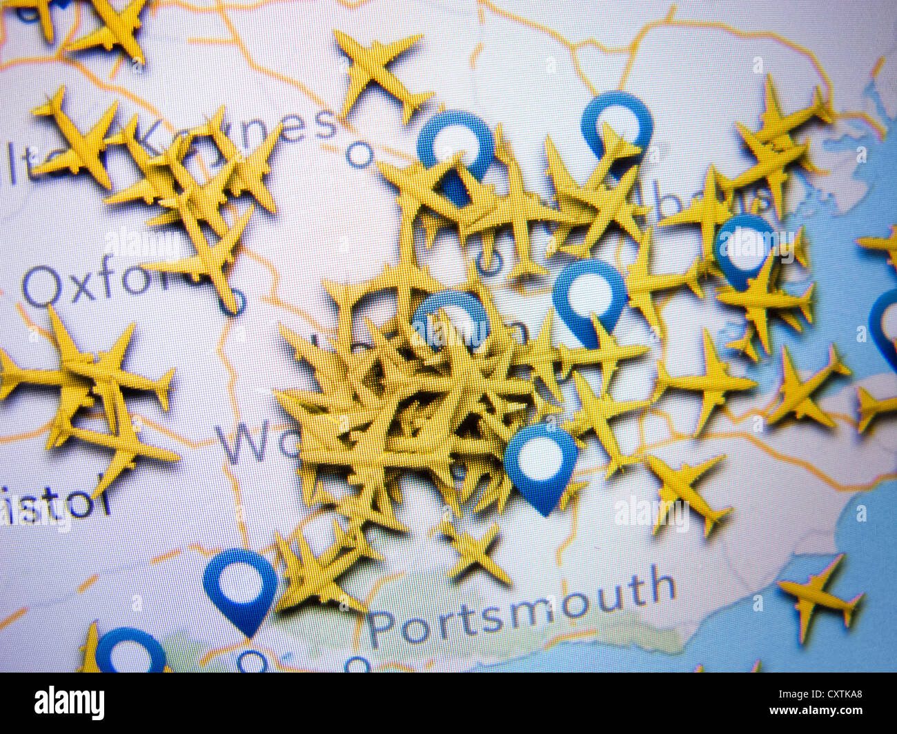 Realtime aircraft radar location many aircraft in congested airspace around Heathrow airport as shown on an app on an iPad Stock Photo
