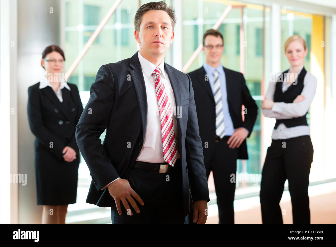 Business - group of businesspeople posing for group photo in office ...