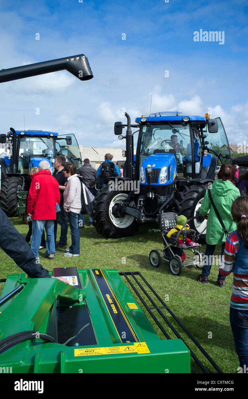 dh West Mainland show DOUNBY ORKNEY Crowds of people looking at farming tractor equipment tractors display uk Stock Photo
