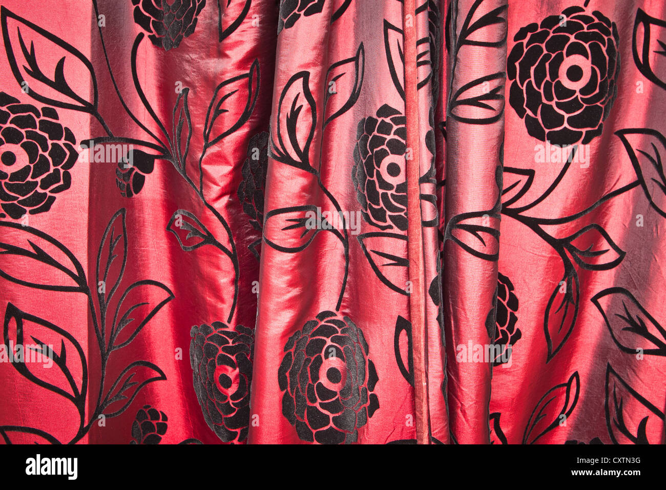 Patterned red curtain as a detailed background image Stock Photo