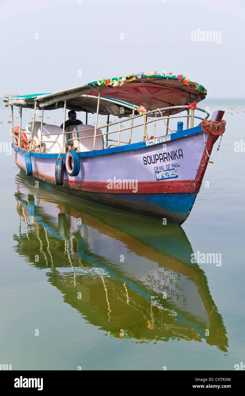 Vertical view of a colourful tour boat in the backwaters of Kerala. Stock Photo