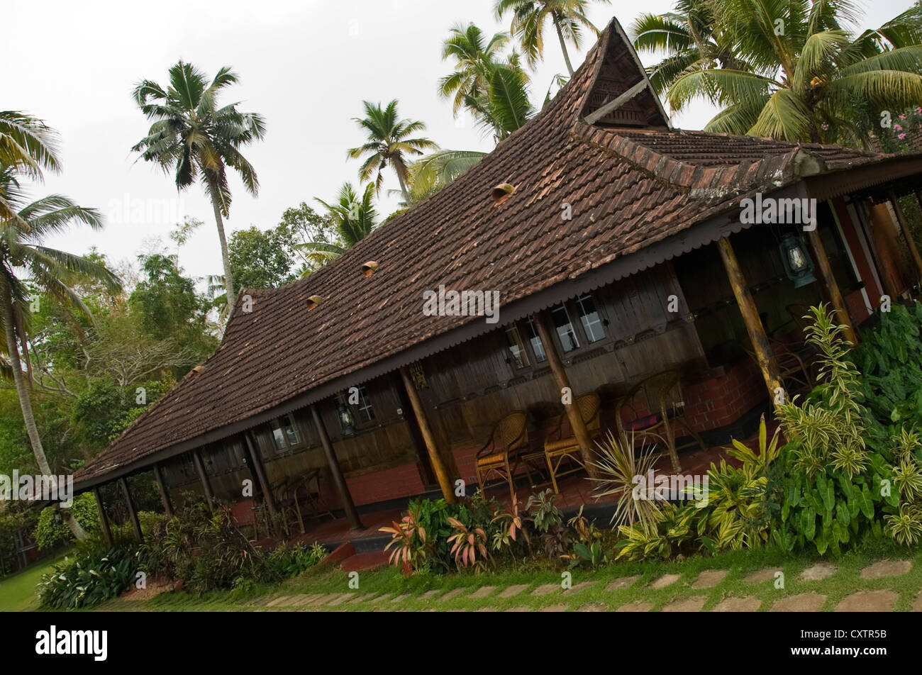 Horizontal view of wooden teak bungalows in a resort in the backwaters of Kerala. Stock Photo