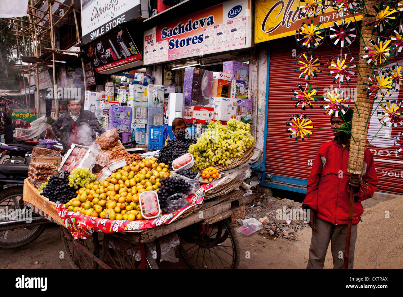 Food vendors in the public market in Dehradun, India, hawk their