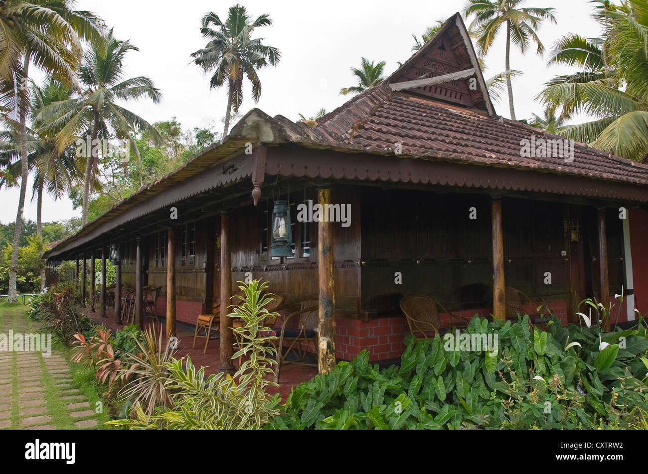Horizontal view of wooden teak bungalows in a resort in the backwaters of Kerala. Stock Photo