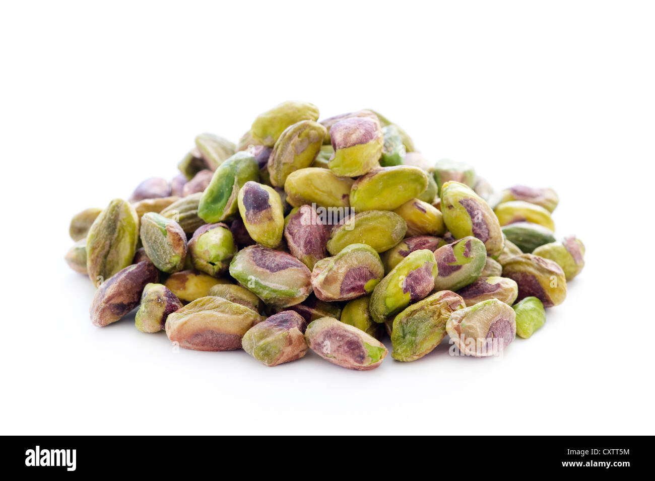 shelled whole pistachio nuts isolated on a white background Stock Photo
