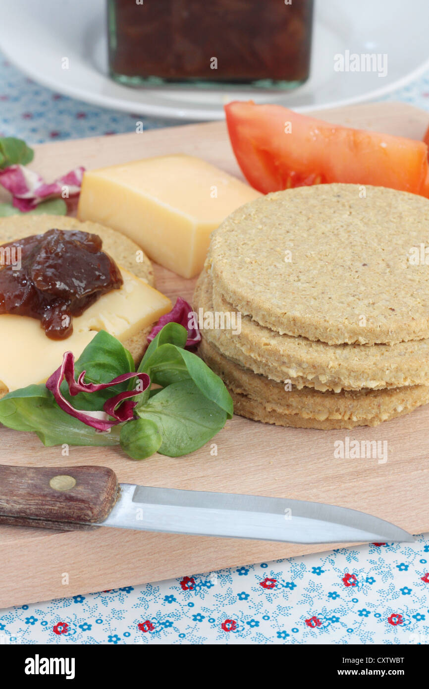 Scottish oatcakes served with cheese and caramelized onion chutney. Stock Photo